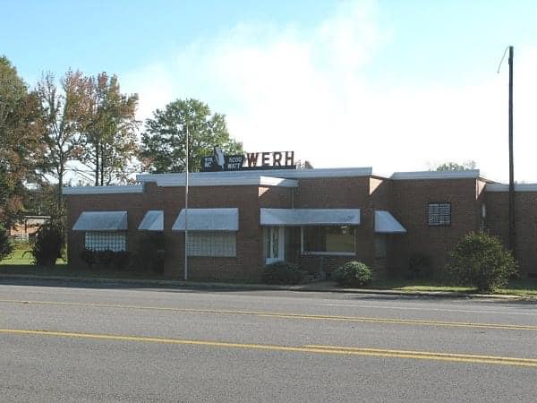 Wide exterior view of the WERH brick radio station building